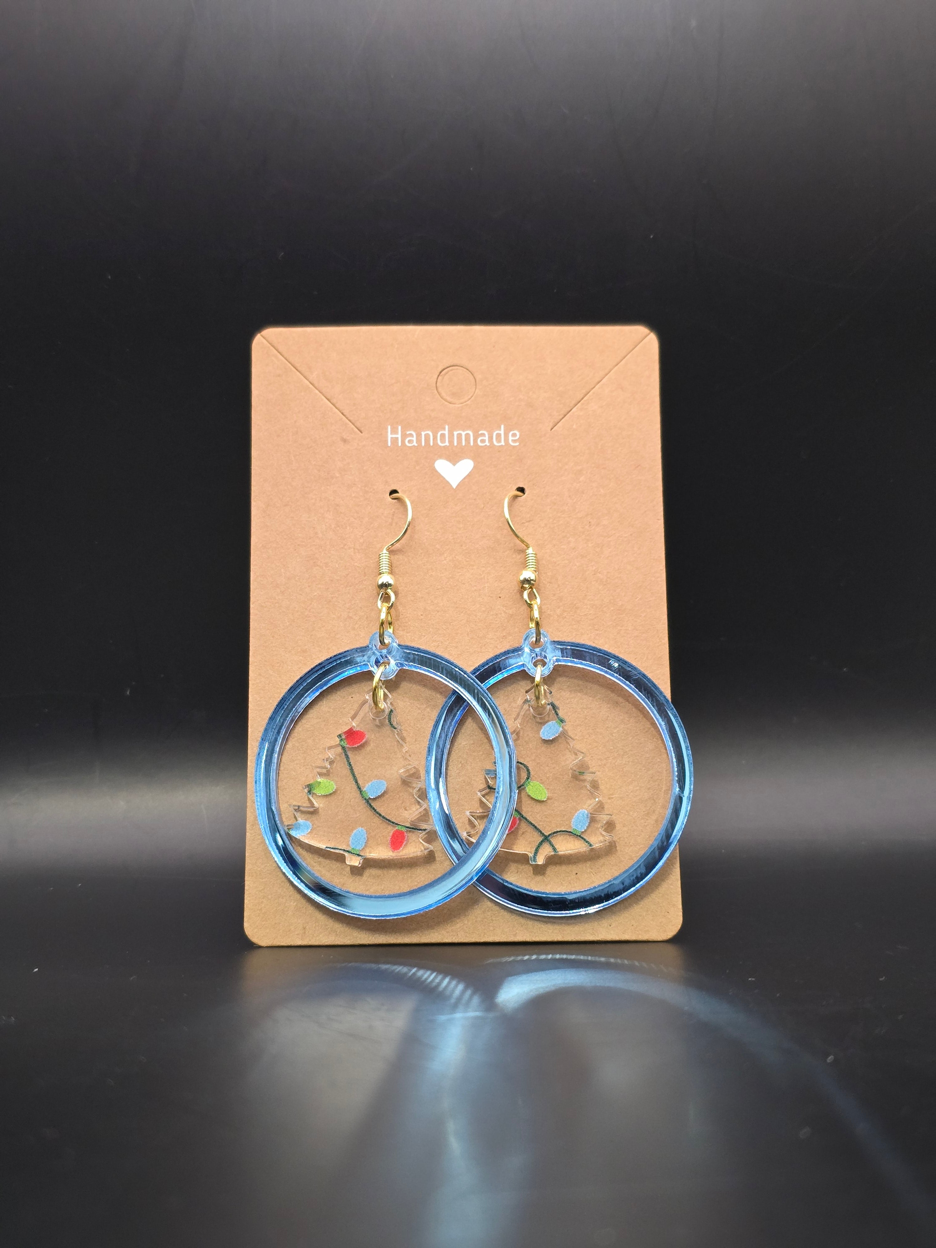 Circle with snowflake or tree earring